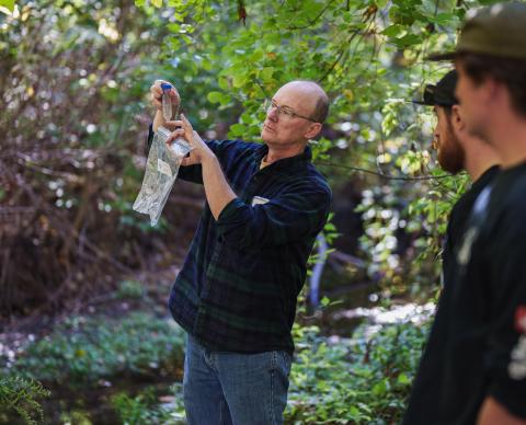 Professor Wil Wollheim collecting samples from College Brook